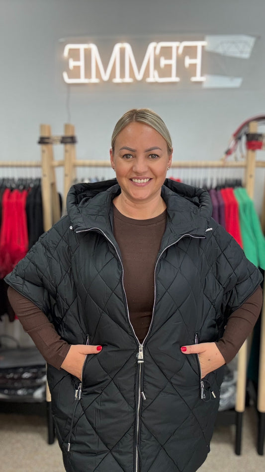 Veste melnā tonī