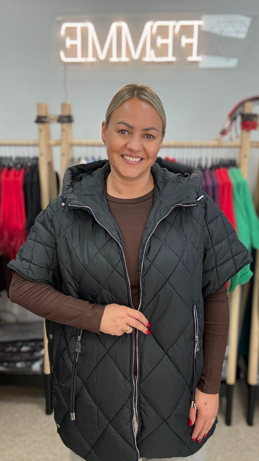 Veste melnā tonī