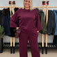 A suit in burgundy tone